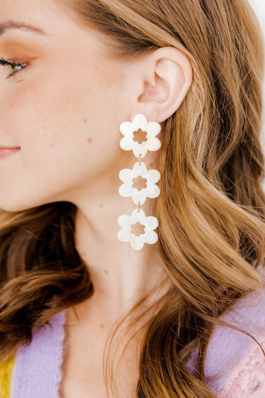Zoey Statement Earrings: large, three-tiered white flower drops. Available in one size.