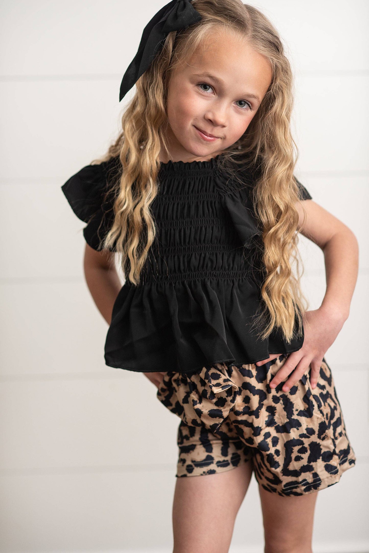 Girls Leopard Shirred Short Set with shirred waist and leopard print. Available in sizes XS-XL.