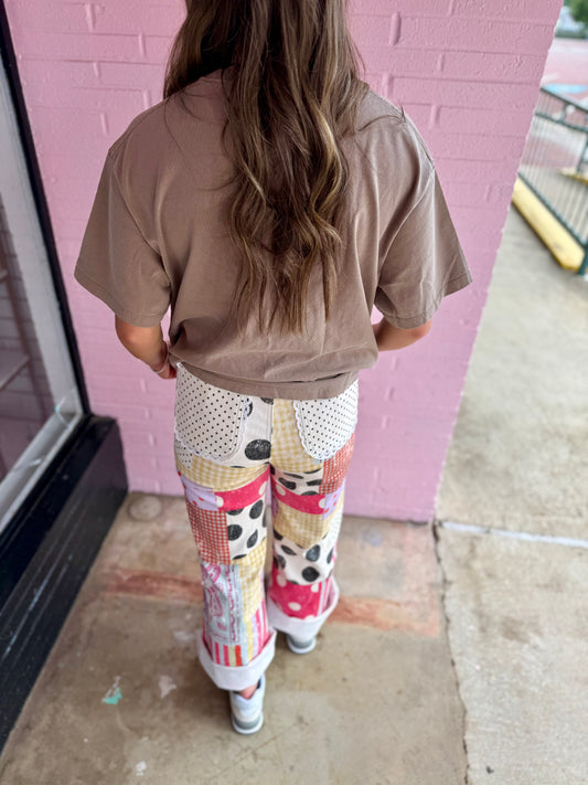 Harper Playful Patch Denim Pants with colorful patterns. Available in sizes XS-XL.