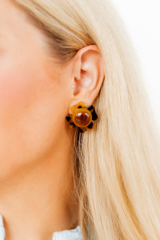 Amelia Earrings: chunky, round, flower-shaped tortoiseshell studs in brown/black. Hypoallergenic. Available in two sizes.