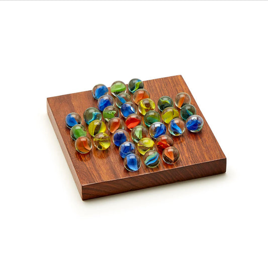 The 2 in 1 Game Set features an acacia wood box with 33 colorful glass marbles in a cross pattern for Solitaire. Sizes vary.