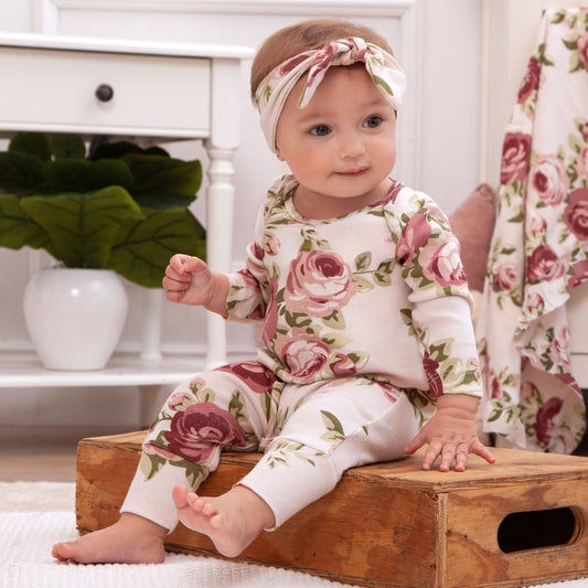 Baby Girl's Cabbage Rose Cotton Romper with matching headband. Available in sizes 0-3M, 3-6M, 6-9M, and 9-12M.