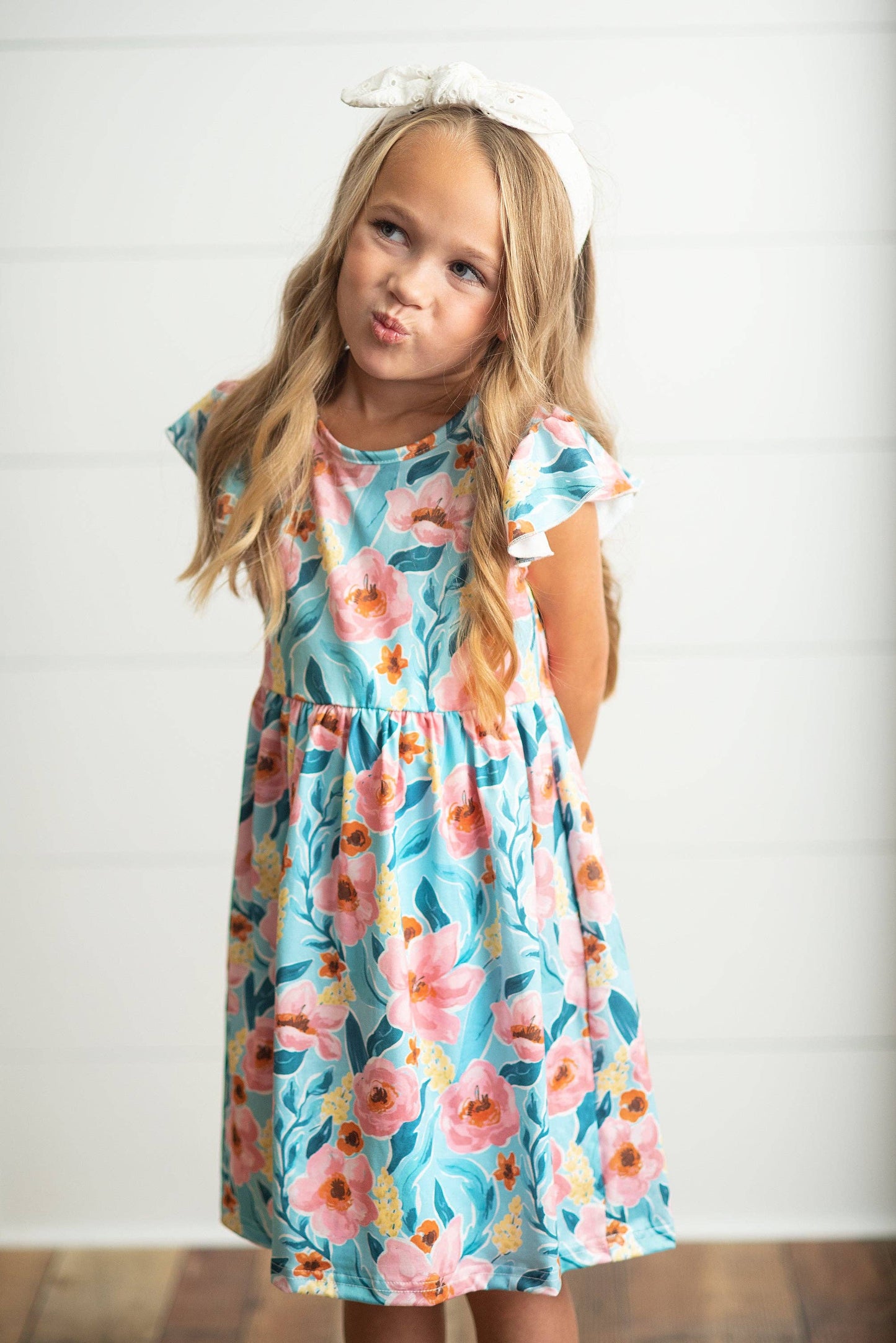 Girls Claire Pink Floral Print Twirl Dress in pink floral pattern. Available in sizes 2T-10.
