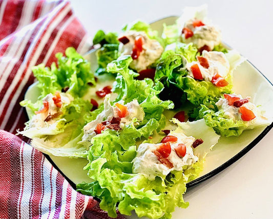 Lettuce wraps with creamy chicken salad made from BLT Dip Mix, topped with tomatoes. Available in small and large sizes.