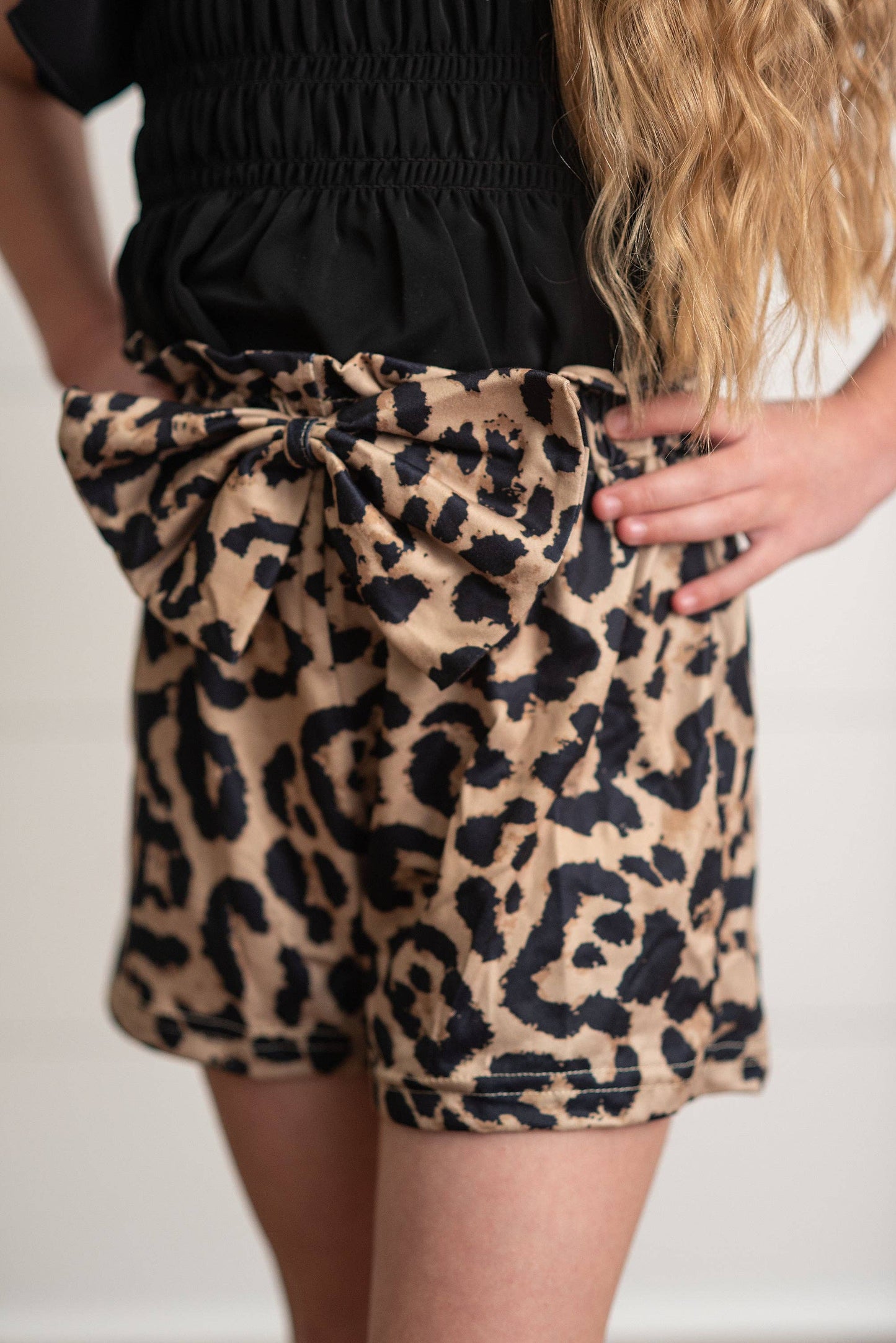 Girls Leopard Shirred Short Set: leopard print shorts with bow, matching black top. Available in sizes 2T-6X.