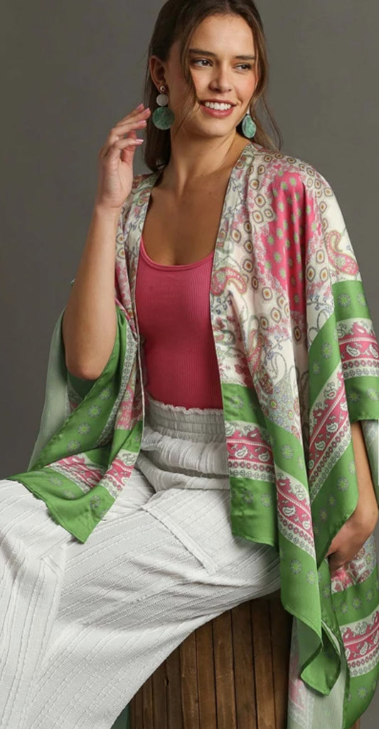 A mixed print open front kimono with 3/4 sleeves, mint, green, pink, beige and white is the variety of color