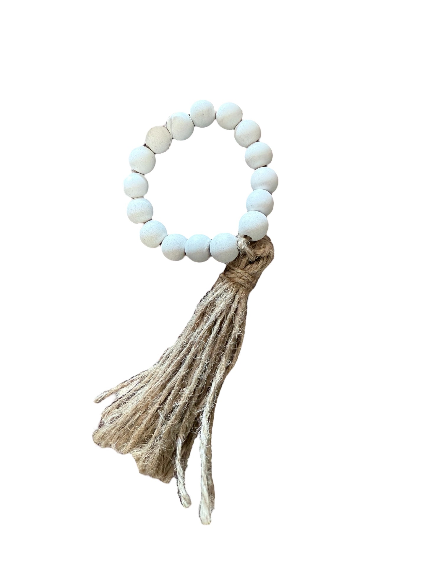 White beaded napkin ring with tan jute tassel, rustic farmhouse style. Sizes available: standard.