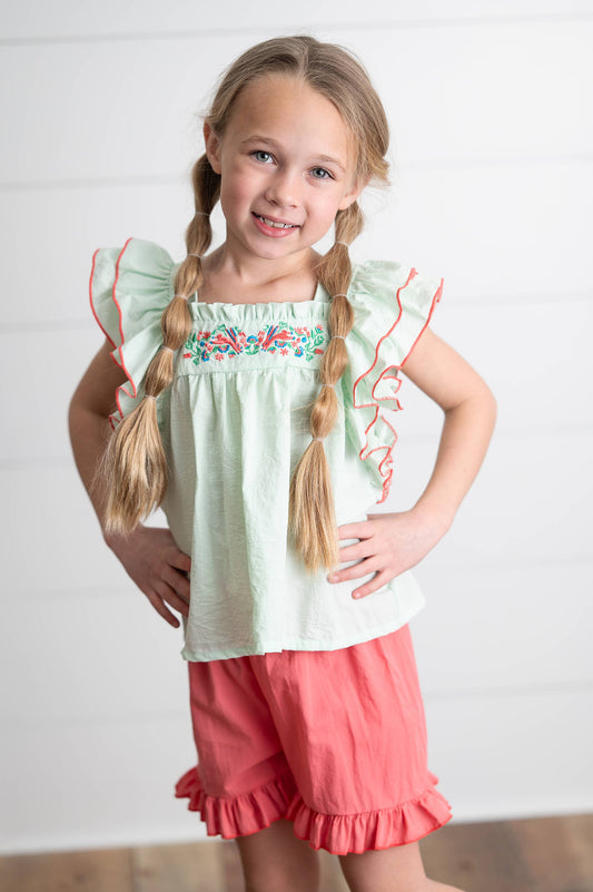 Girls Embroidered Mint Ruffle Top & Pink Short Set, available in sizes 2T-8. Features mint ruffles and pink shorts.