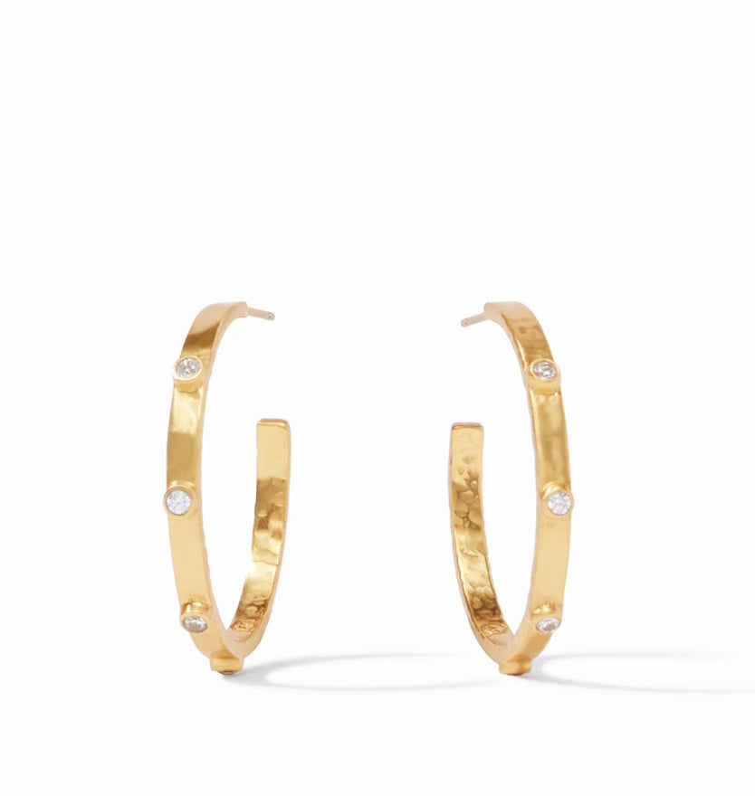 Hammered gold hoop earrings with evenly spaced round white cubic zirconia. Available sizes: 20mm, 30mm, 40mm.