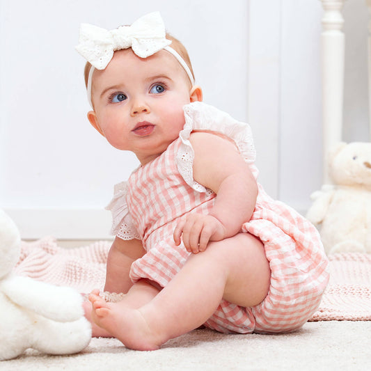 Baby Pink Gingham Cotton Summer Romper with white bow headband, available in sizes 0-24 months.