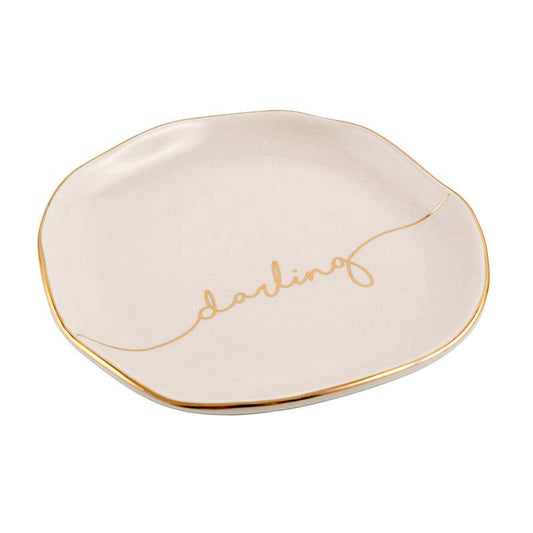 Cream ceramic tray, irregular shape, gold rim, “darling” in gold cursive. Available size: 5x4 inches.