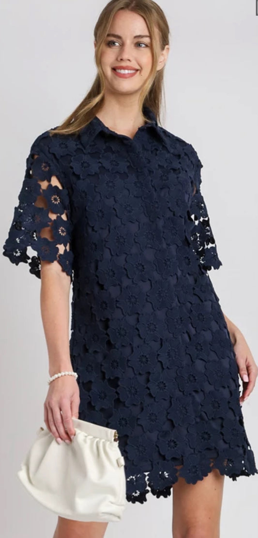 Short sleeve floral overlay navy dress a line buttons down the front comes in small, medium and large