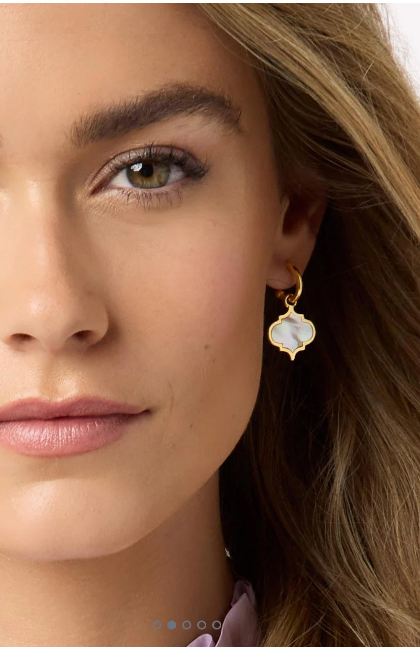 The Helene Inlay Hoop & Charm Earring Gold is a stylish accessory. Features a hoop design with an attached charm for added elegance. Made using high-quality, durable gold-toned material. Perfect for adding an extra spark to any outfit. Suitable for all types of occasions and styles. Available in one standard size that fits comfortably on the earlobe.