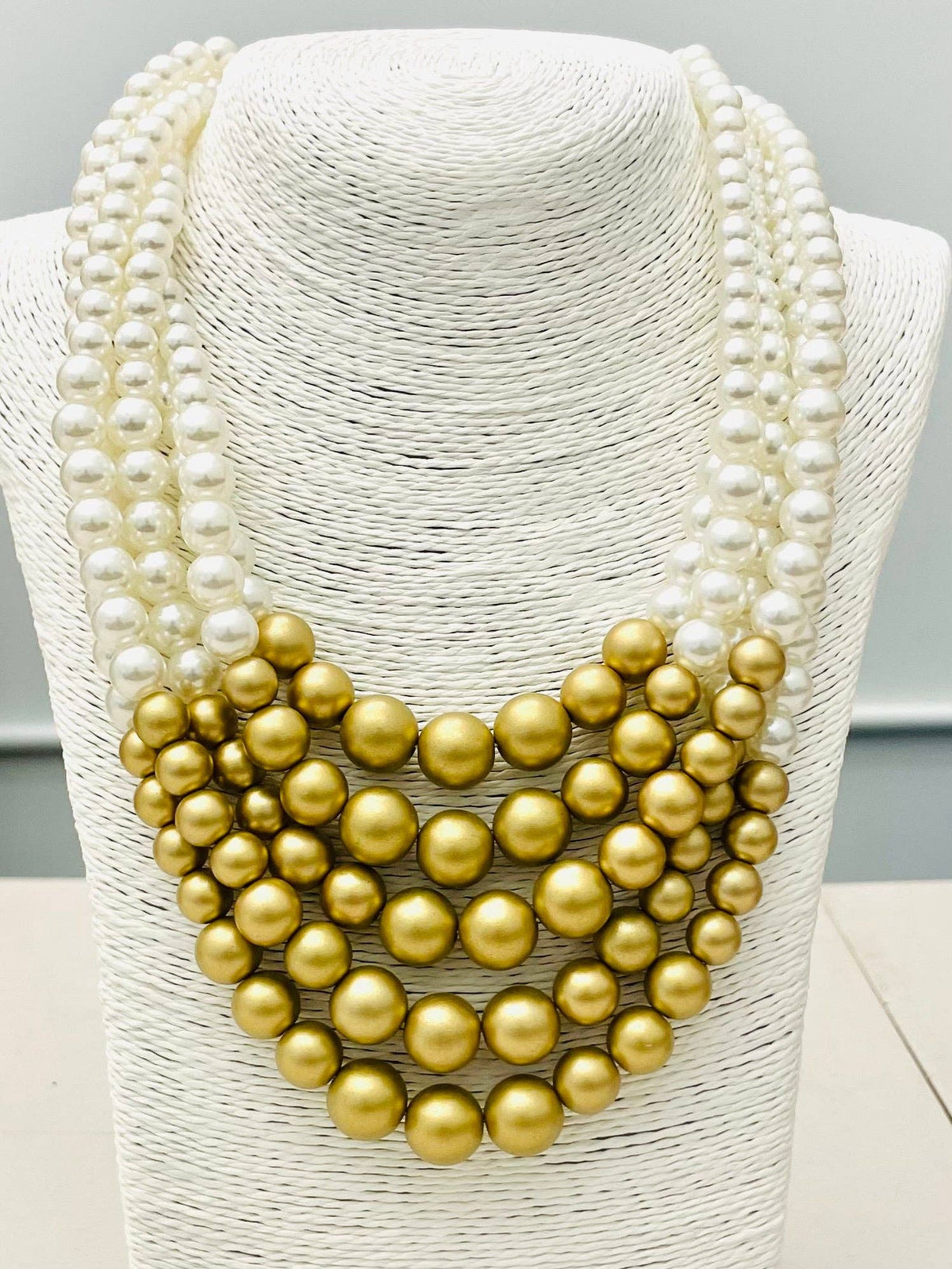 The CHIC - 5-Strand Pearl Necklace (white/matte gold) NK891 features alternating rows of high luster white and matte gold large round beads. Available in multiple lengths.