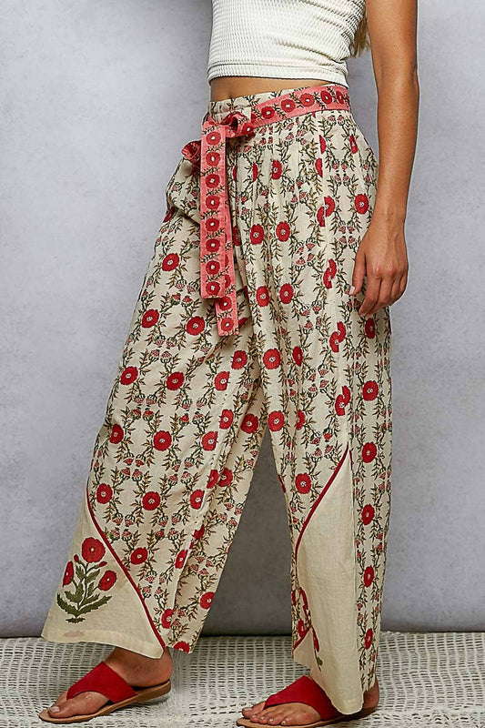 Straight Fit Waist Belt Floral Pattern Pants in cream with red floral print, embroidered panel, tie belt. Sizes: XS–XL.