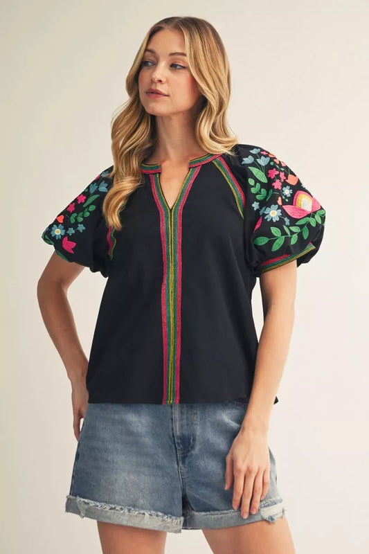Black Embroidery Detail Puff Sleeve Top with colorful floral patterns, short sleeves. Available in sizes XS-XL.
