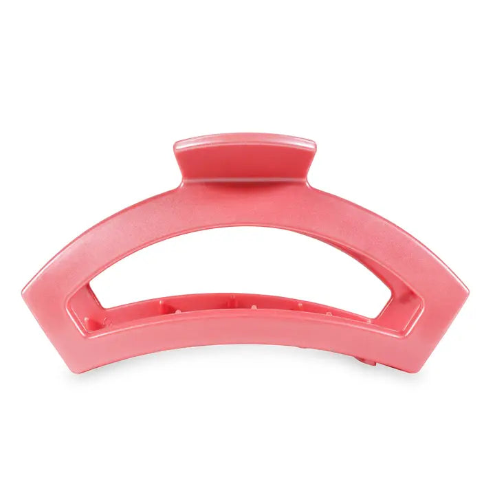 Large pink TELETIES Open Claw Hair Clip with curved shape and wide handle; available in multiple sizes.