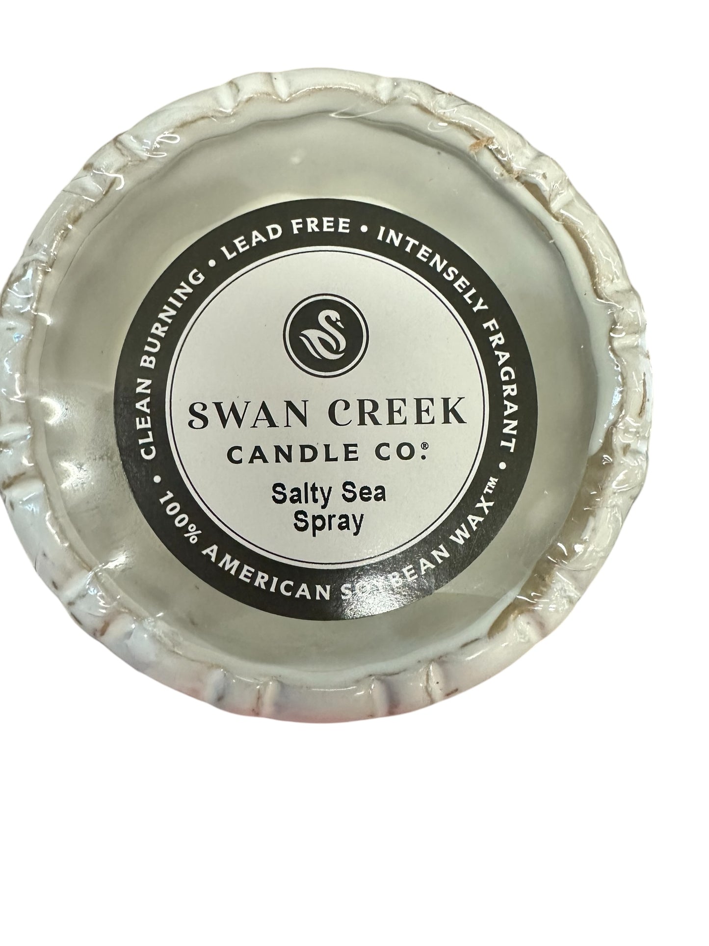 Small round white "Salty Sea Spray" soy candle by Swan Creek; clean burning, lead free, available in small fluted pot size.