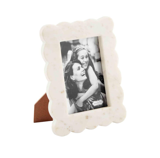 The small scalloped marble frame is 8 1/4" x 6 1/4" it is scalloped white marble which would hold a 4 x 6 picture