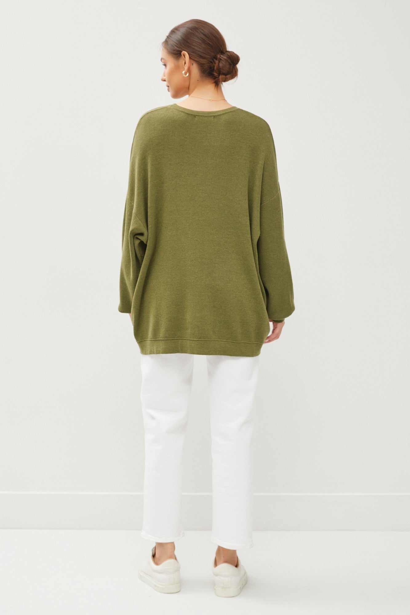 The Augusta Sweater in olive green, relaxed fit for layering. Available in XS–XL.