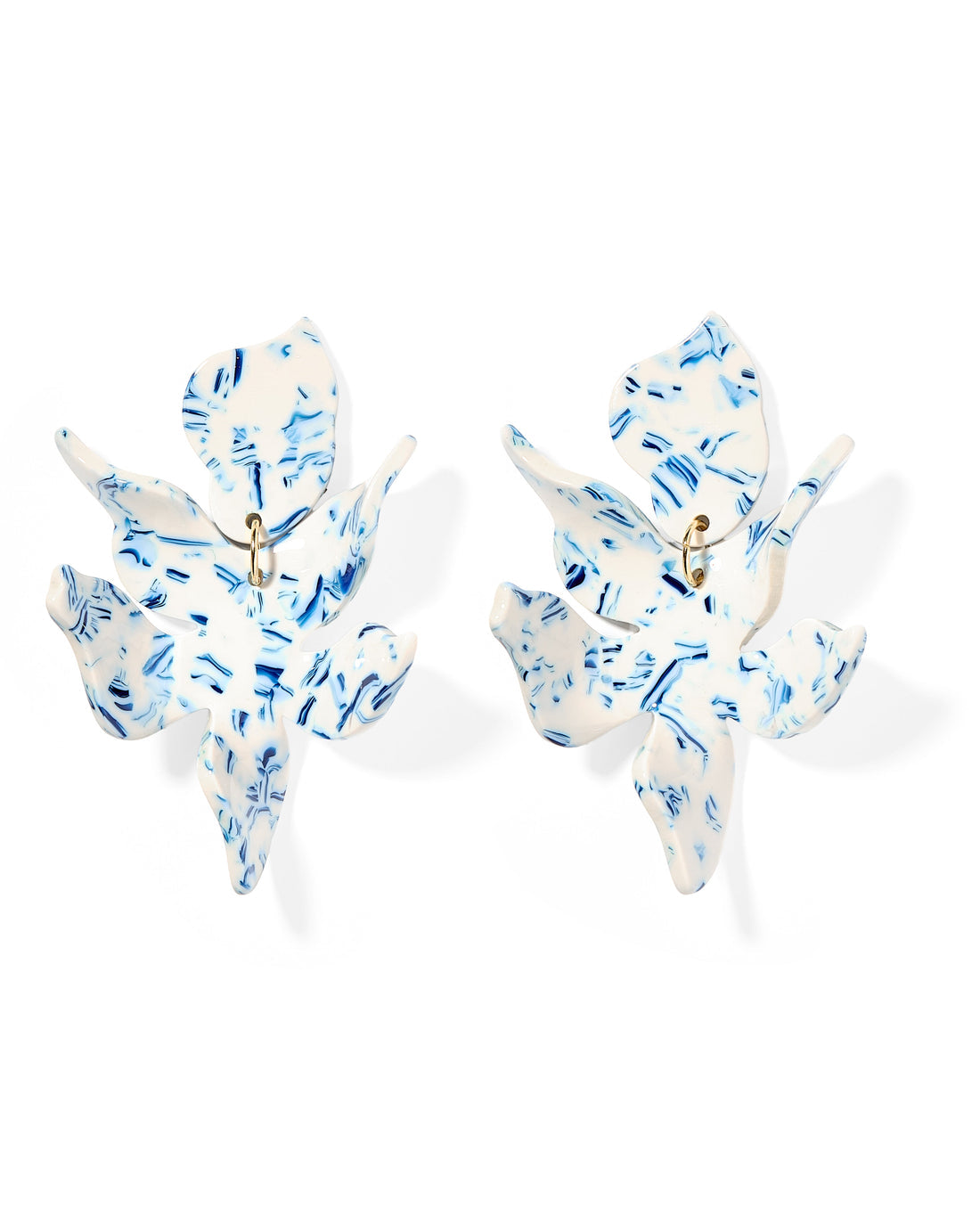White floral statement earrings with blue speckles and gold centers. Available sizes: small, medium, large.