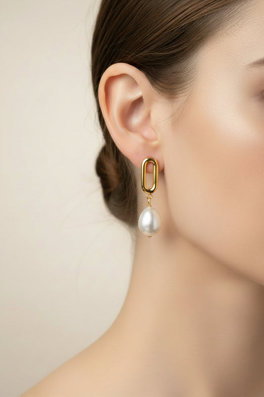 Gold drop earrings with dangling white pearl. Available in small (2cm), medium (3cm), and large (4cm) sizes.