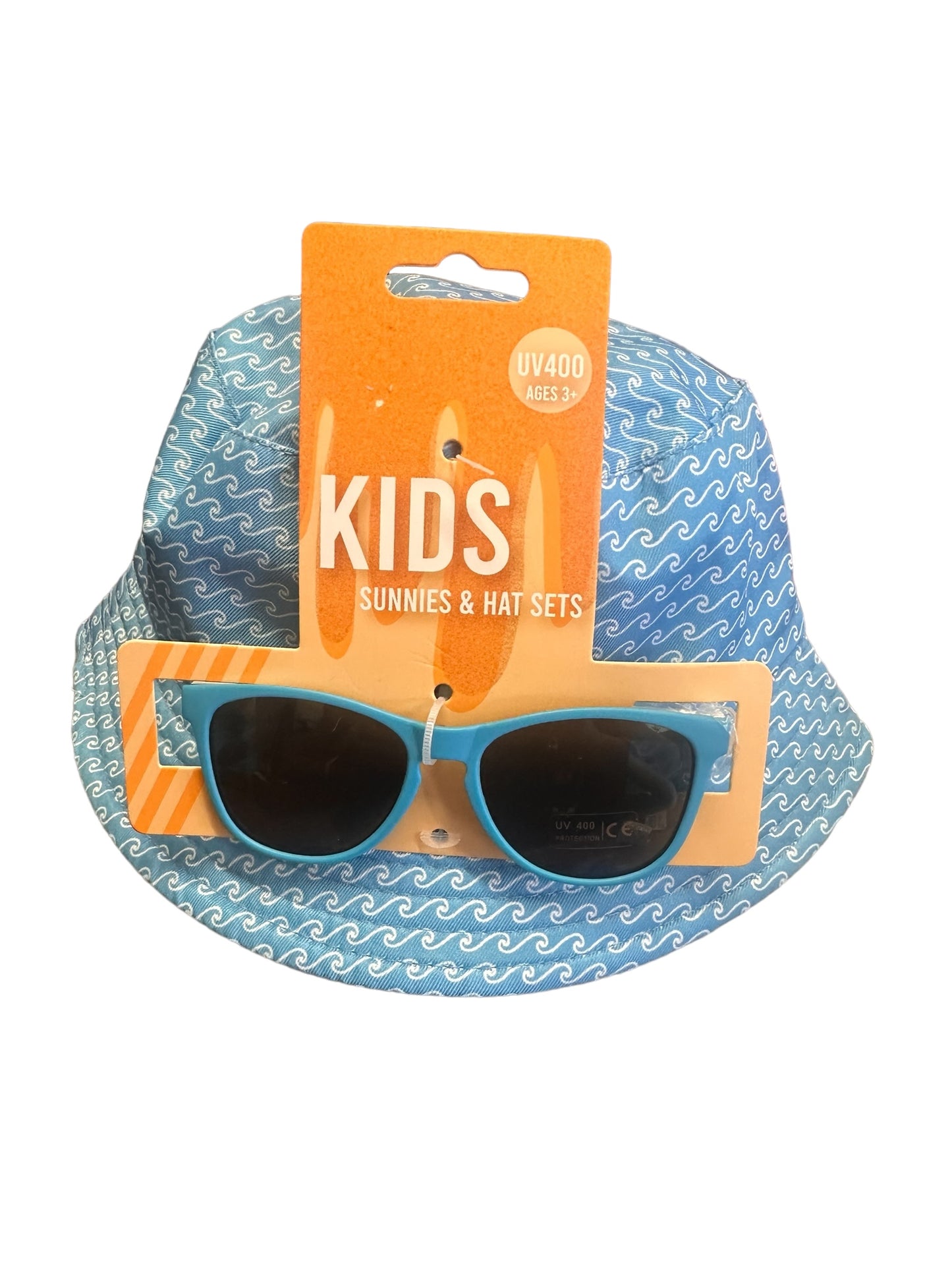 Kids Sunnies & Hat Set on an orange card. Includes a blue hat with white wave pattern and blue sunglasses. UV400 protection. For ages 3+. Available sizes: One size fits most.