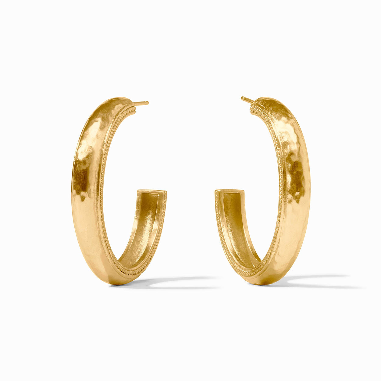 Large 24K gold plated hoop earrings with hammered texture and decorative edging. Available in one large size.