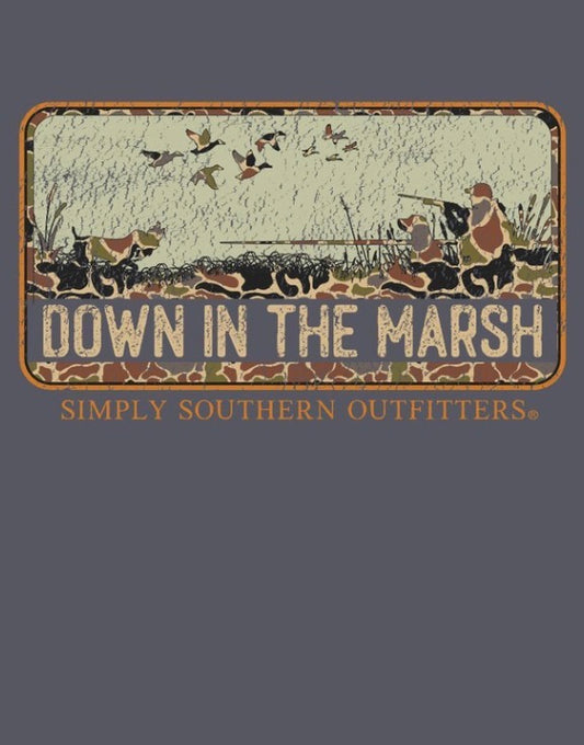 The Down In The Marsh Graphic Tee features a rustic “DOWN IN THE MARSH” sign with silhouettes of hunters, dogs, and flying ducks; bold orange “SIMPLY SOUTHERN OUTFITTERS” lettering sits below the scene on a dark background. Available in sizes S–XXL.