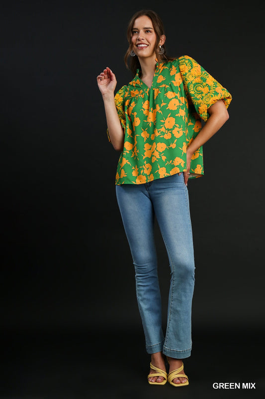 Green Mix Top with floral pattern, embroidered sleeves, and split neck. Available in sizes XS to XL.