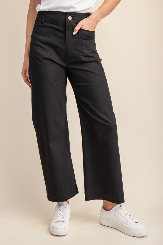 High-waisted black ankle-cropped summer pants, wide legs, front pockets, button-zip. Stretchy denim. Sizes: XS-XL.
