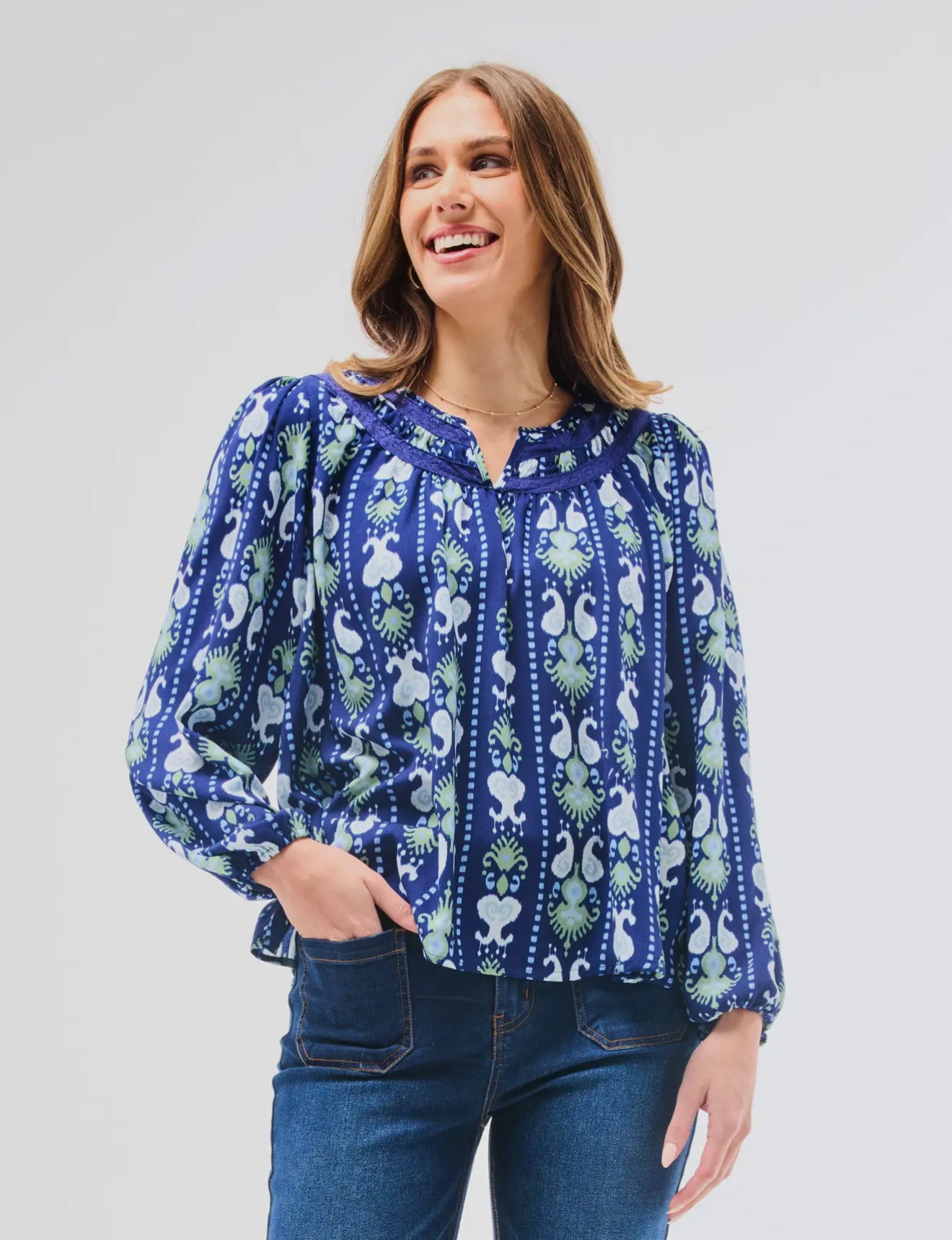 Janelle Top Ikat Stripe with notched neckline and crochet lace trim. Available in sizes XS-XL.