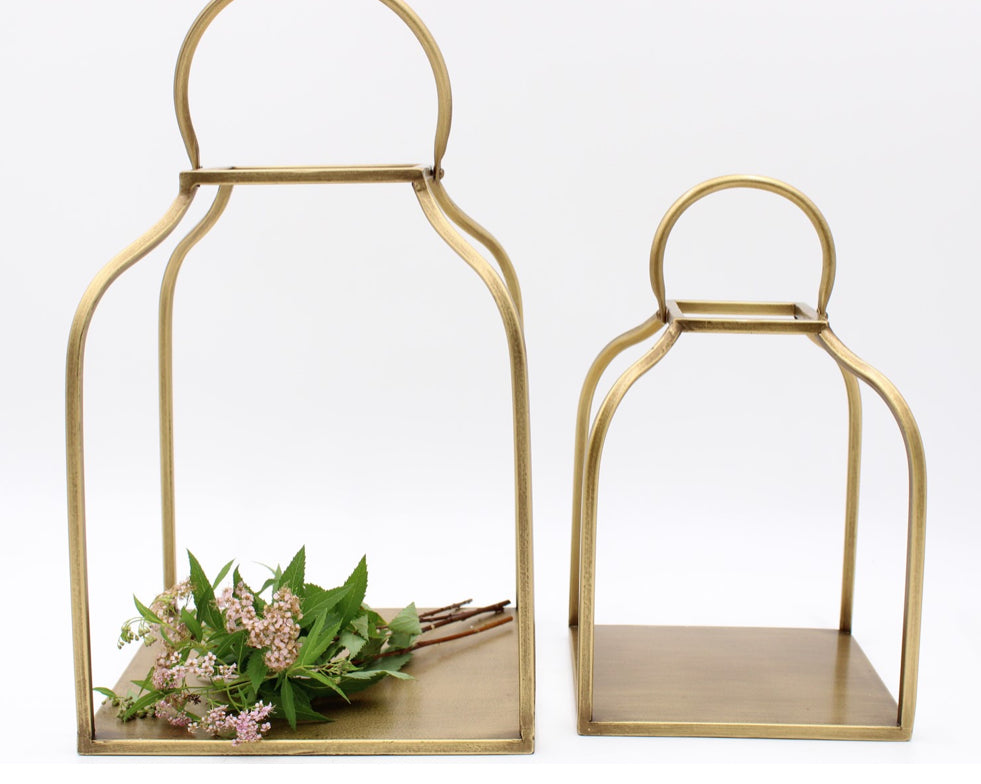 Set of two antique gold metal lanterns, available in large and small sizes.