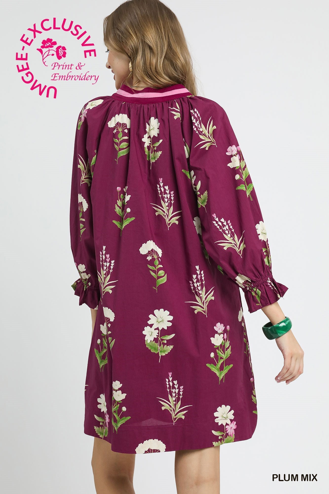 Long-sleeved floral tunic dress in plum mix with contrast trim, gathered cuffs, relaxed fit. Sizes: XS-XL.