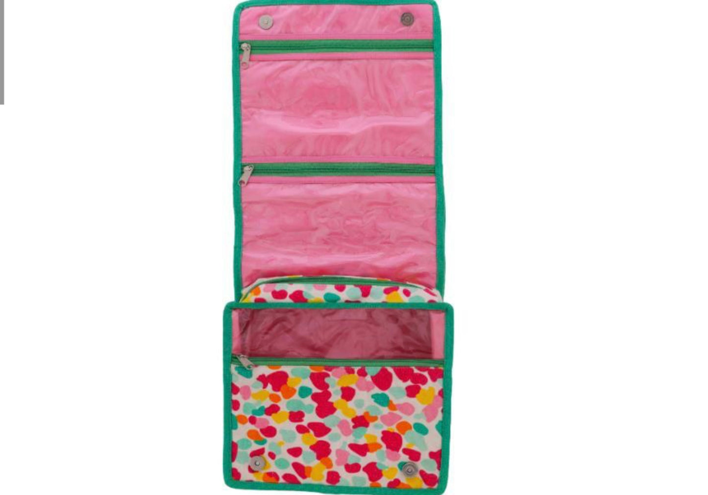 Confetti Bloom Travel Organizer with green trim, pink lining, two clear zip pockets, large pocket with heart pattern. Sizes: S/M/L.