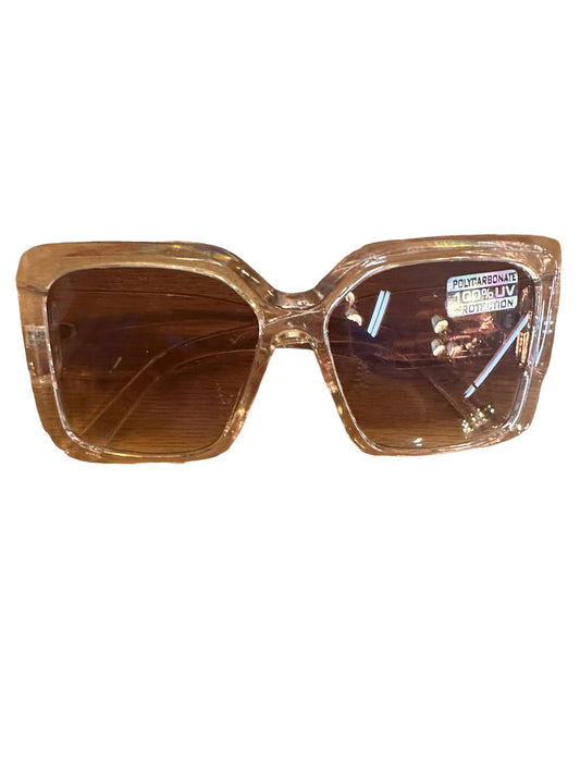 Large Square Frame Sunglasses with clear, light brown frames and brown lenses. "Polycarbonate 100% UV Protection" sticker on the right lens. Available sizes: large.
