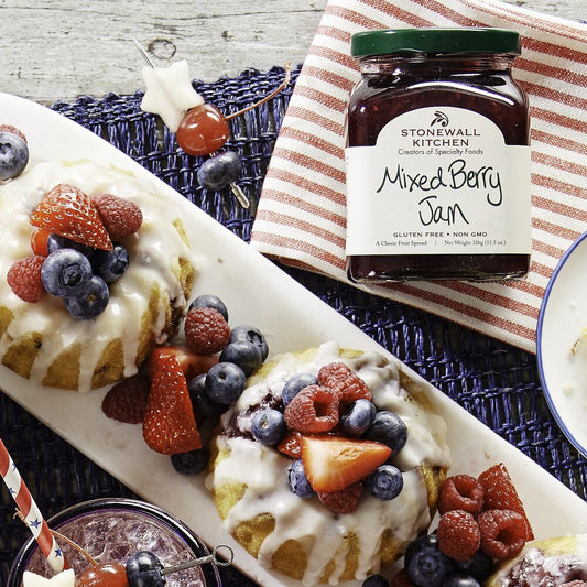 Mixed Berry Jam drizzled over desserts, available in 11.05oz size.