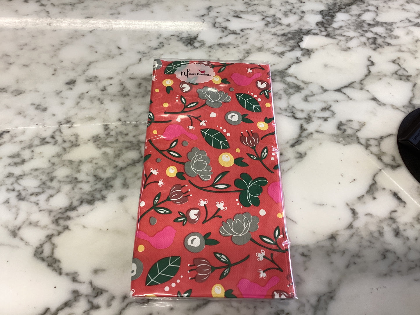 Rectangular pack of Cardinal Guest Towels wrapped in floral paper, red, green, white, and yellow. Available in standard sizes.