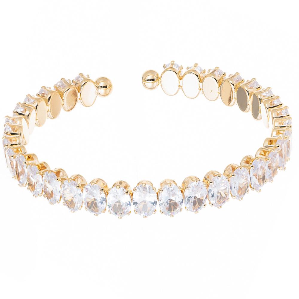 Gold open cuff bracelet with two rows of oval-cut clear gemstones. Available in small, medium, and large sizes.