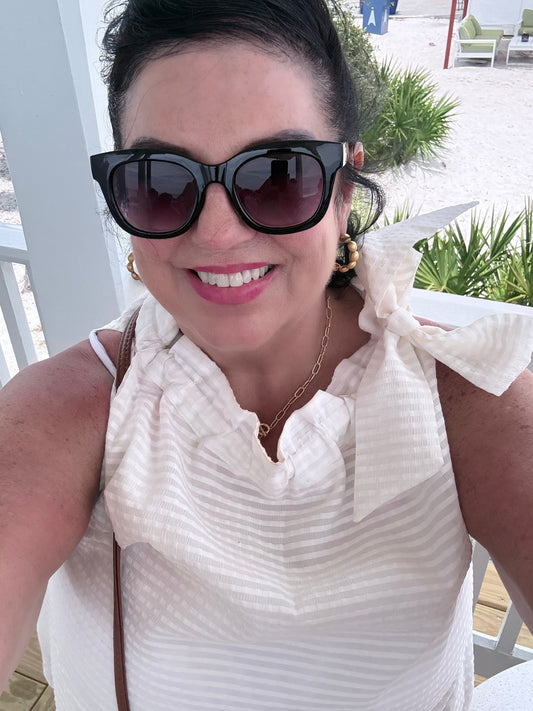 White Ruffle Neck Tie Sleeveless Top, available in sizes XS–XL. Features ruffle neck and tie detail.