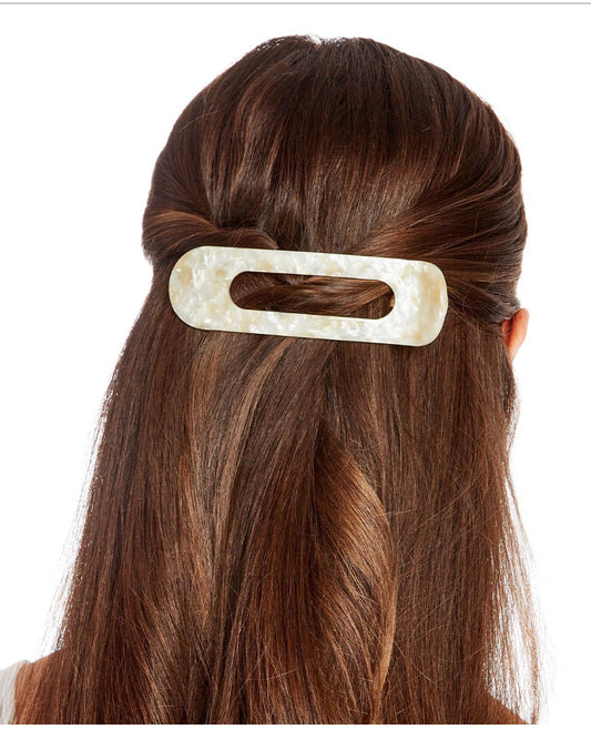 Oversized Claw Clip: Large, rectangular design with oval cutout. Made from marbled acetate. Sizes available: One size fits all.