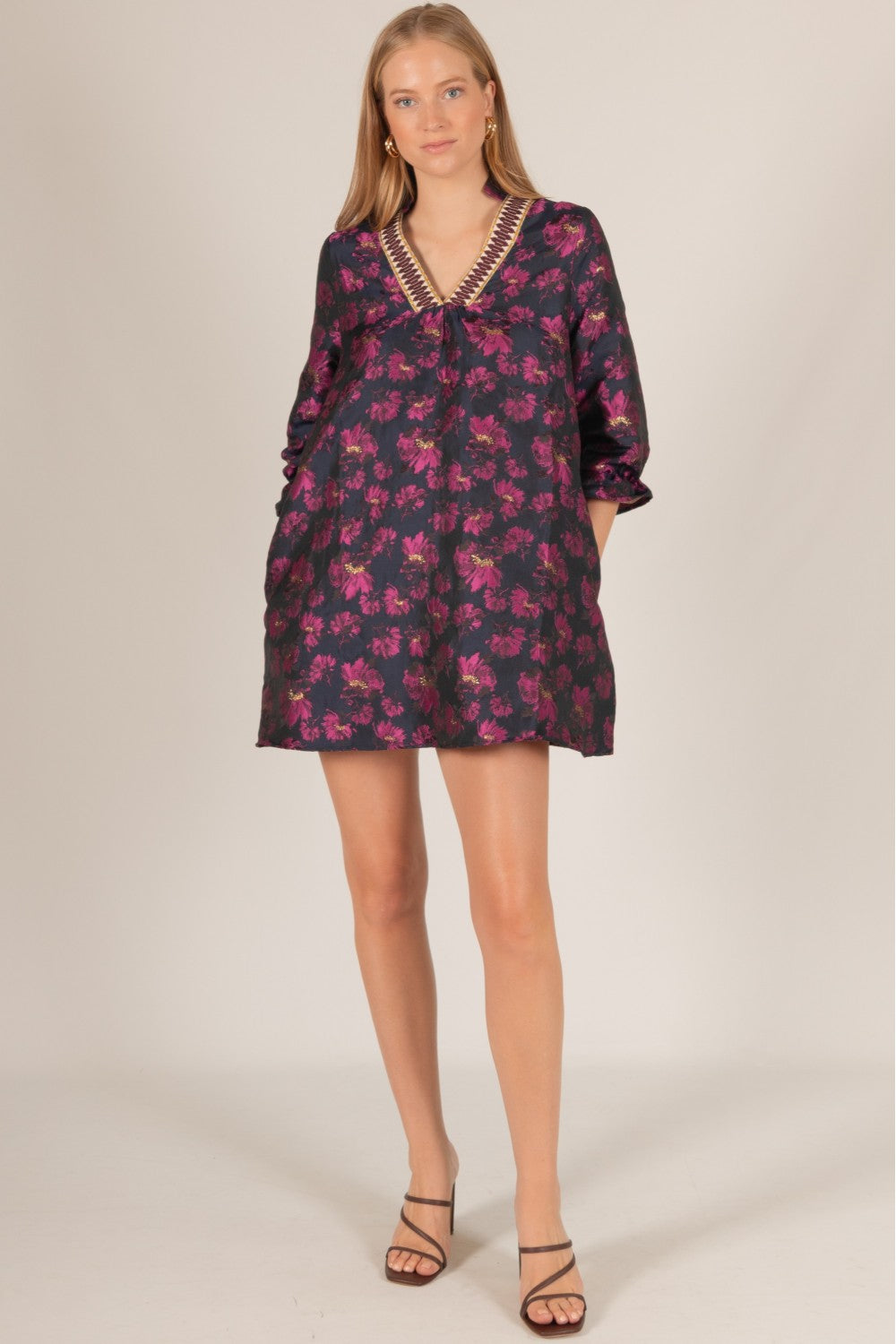 Floral Jacquard 3/4 Sleeve Dress with V-neck and decorative trim. Black dress with pink and purple floral pattern. Sizes: XS, S, M, L, XL.