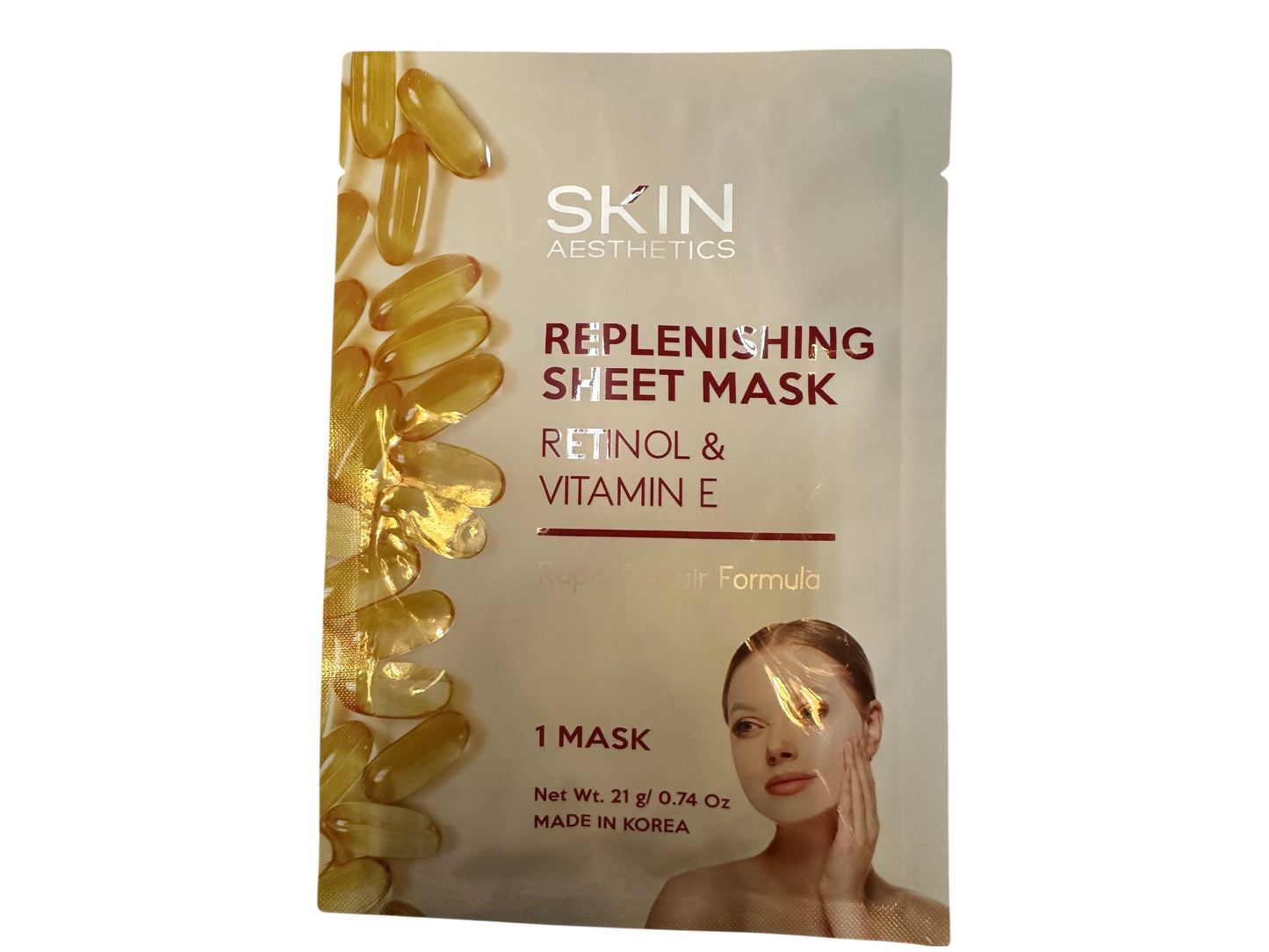 Face Mask packet with retinol and vitamin E, golden capsules on left. Reduces dark circles, boosts collagen. Sizes: 20ml, 30ml.
