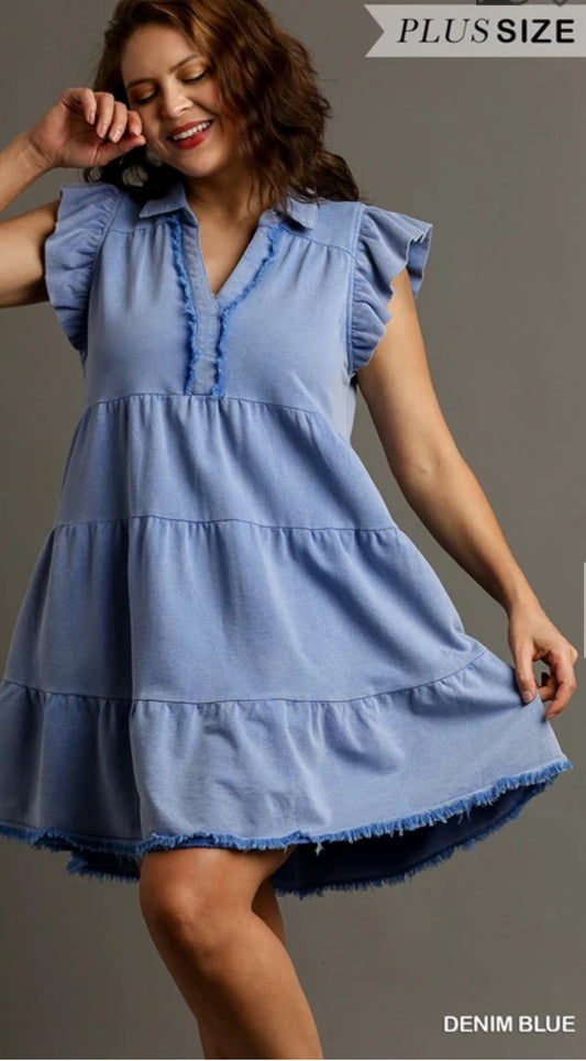  French Terry, flutter dress in a light blue, with a V-neck with a collar. The hem is rough edge, as well as down the neck.