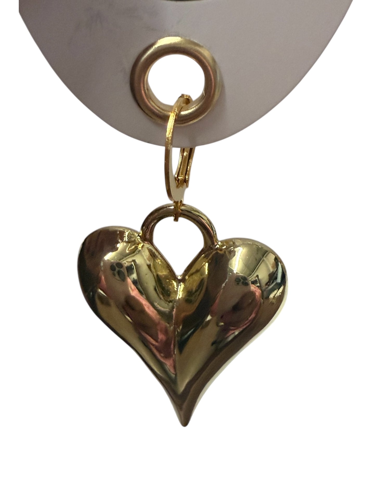 Shiny gold heart-shaped pendant with rounded, puffy design and small loop holder; available in multiple sizes.