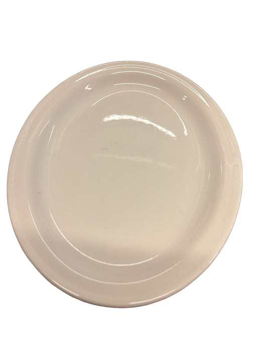 Round white stoneware dish with smooth surface and slightly raised edge. Available in 8", 10", and 12" sizes.