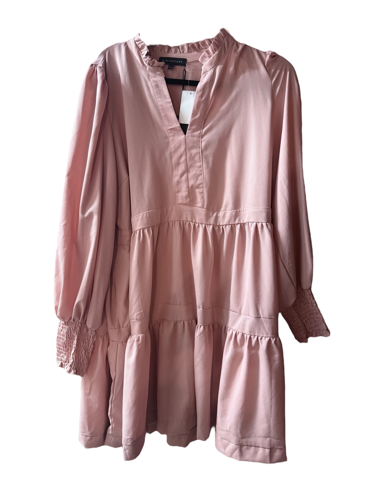 Loose-fitting salmon tiered dress with v-neck, ruffle neck, long sleeves, smocked cuffs; available in sizes XS-XL.