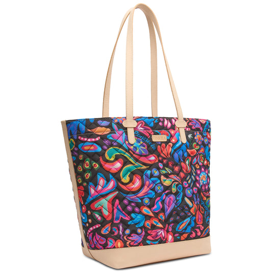 Sam Daily Tote with light tan handles/base, multicolored abstract quilted fabric. Spacious interior. Available in multiple sizes.