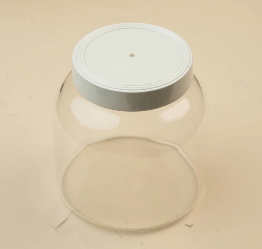 Clear glass jar with a white screw-on lid featuring a small central hole; available in multiple sizes.
