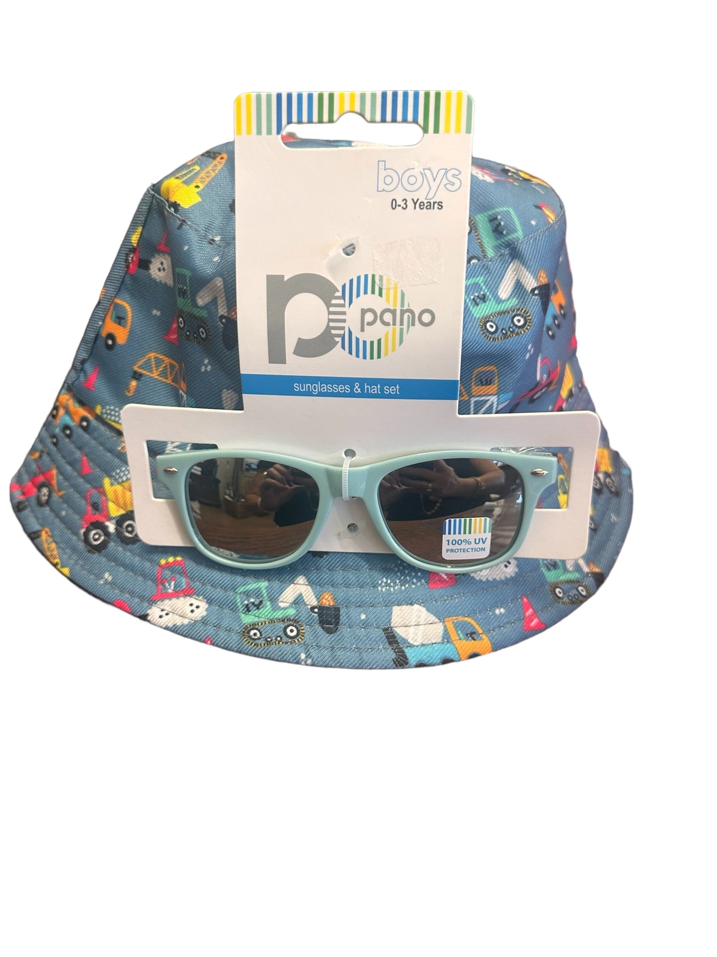 A stylish blue bucket hat with a colorful vehicle print for boys aged 0-3 years. Comes with light blue sunglasses featuring UV400 protection. Available sizes: Small, Medium, Large.